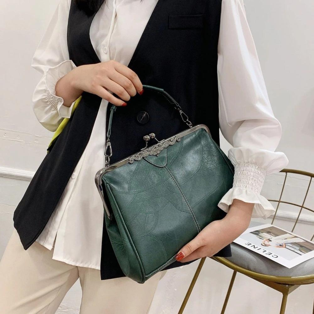 Klassische Handtasche mit Kiss-Lock-Verschluss