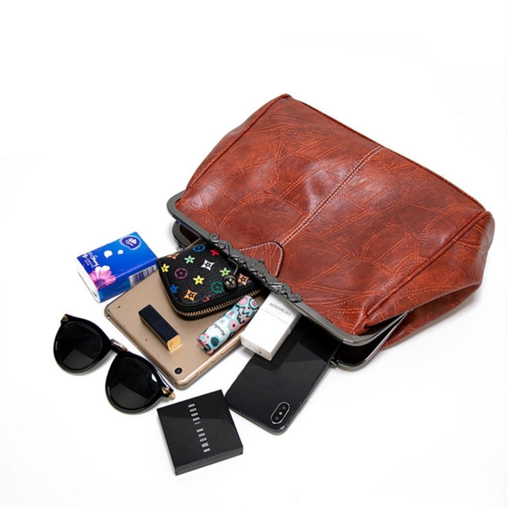 Klassische Handtasche mit Kiss-Lock-Verschluss